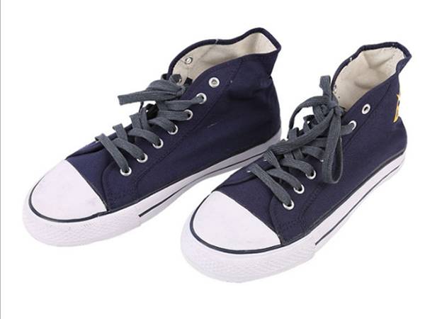 A pair of black and white insulated canvas safety shoes