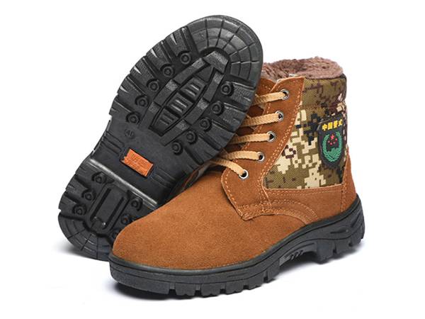 A pair of brown and camouflage warm safety shoes