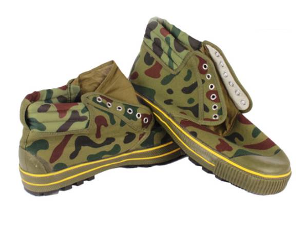 A pair of camouflage canvas high shoes