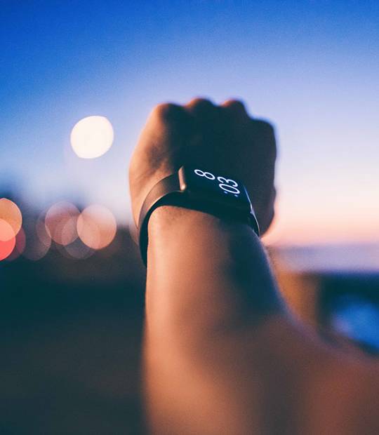 A man is looking at the watch to check the time.