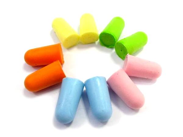 Five pairs of foam earplugs in different colors are displayed.