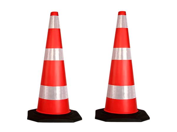 Red and white reflective tape is pasted on two traffic cones.