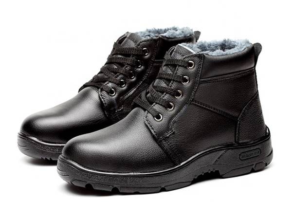 A pair of black steel toe warm safety shoes