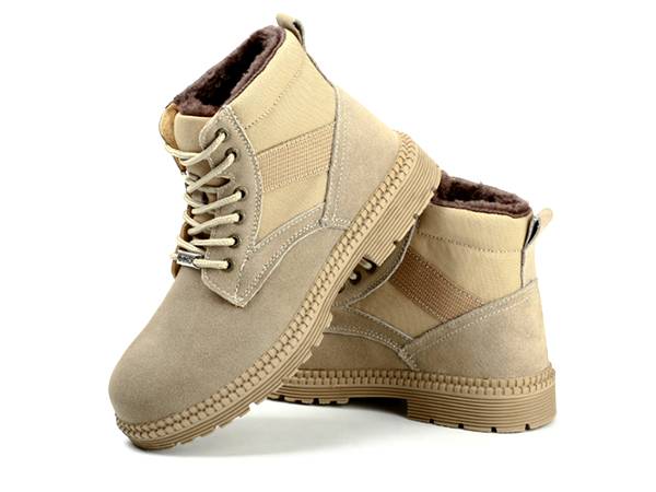 A pair of light-yellow wool lining warn safety shoes.